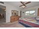 Bright bedroom with a comfortable bed and dresser at 10432 W El Capitan Cir, Sun City, AZ 85351