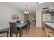 Dining area with table, chairs, and view into living room at 10432 W El Capitan Cir, Sun City, AZ 85351