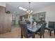 Kitchen and dining area with granite table and stainless appliances at 10432 W El Capitan Cir, Sun City, AZ 85351