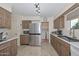 Kitchen with stainless steel appliances and view of laundry area at 10432 W El Capitan Cir, Sun City, AZ 85351