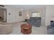 Living room with couches, coffee table, and view to dining area at 10432 W El Capitan Cir, Sun City, AZ 85351