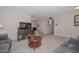 Living room with comfortable seating and a view into the dining area at 10432 W El Capitan Cir, Sun City, AZ 85351