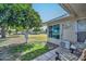 Relaxing patio with an orange tree and seating area at 10432 W El Capitan Cir, Sun City, AZ 85351