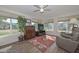 Sunroom with large windows, comfortable seating, and a beautiful rug at 10432 W El Capitan Cir, Sun City, AZ 85351