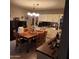 Dining room with wood table, hutch, and bar area at 10544 W Campana Dr, Sun City, AZ 85351