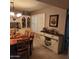 Dining room with wood table, hutch, and bar area at 10544 W Campana Dr, Sun City, AZ 85351