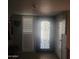 Interior entryway with a decorative glass door and white shutters at 10544 W Campana Dr, Sun City, AZ 85351