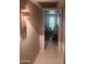 Hallway with access to bedroom and tiled floor at 10544 W Campana Dr, Sun City, AZ 85351