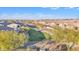 Aerial view of community park with walking paths and homes at 11026 S 55Th Ln, Laveen, AZ 85339