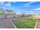 Artificial turf backyard with gravel border at 11026 S 55Th Ln, Laveen, AZ 85339