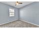 Bright bedroom with ceiling fan and carpet flooring at 11026 S 55Th Ln, Laveen, AZ 85339