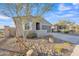 Single-story home with landscaped front yard and attached garage at 11026 S 55Th Ln, Laveen, AZ 85339