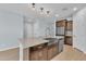 Modern kitchen with farmhouse sink, stainless steel appliances, and granite countertops at 11026 S 55Th Ln, Laveen, AZ 85339