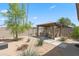 Landscaped backyard featuring a pergola and desert landscaping at 12211 N 57Th St, Scottsdale, AZ 85254