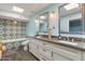 Spa-like bathroom featuring a soaking tub, double vanity, and patterned tile at 12211 N 57Th St, Scottsdale, AZ 85254