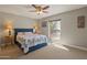 Comfortable bedroom with a navy blue bed frame and large window at 12211 N 57Th St, Scottsdale, AZ 85254