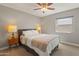 Serene bedroom with a gray bed frame and plenty of natural light at 12211 N 57Th St, Scottsdale, AZ 85254