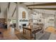 Farmhouse style dining table with bench seating and view of the kitchen at 12211 N 57Th St, Scottsdale, AZ 85254