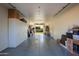 Large garage with ample storage and shelving at 12211 N 57Th St, Scottsdale, AZ 85254