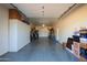 Spacious garage with ample storage shelving and cabinets at 12211 N 57Th St, Scottsdale, AZ 85254