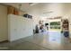 Organized garage with built-in storage cabinets at 12211 N 57Th St, Scottsdale, AZ 85254