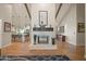 Open kitchen with island, white cabinets, and wood beam ceiling at 12211 N 57Th St, Scottsdale, AZ 85254