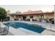 Refreshing pool, expansive patio, and outdoor kitchen area at 12211 N 57Th St, Scottsdale, AZ 85254