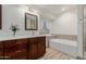 Updated bathroom with a soaking tub and separate shower at 1237 E Heather Ave, Gilbert, AZ 85234