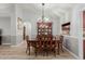 Dining room with a wooden table and chairs, and a china cabinet at 1237 E Heather Ave, Gilbert, AZ 85234