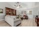 Living room with light beige sofa, wood flooring, and built-in shelving at 1237 E Heather Ave, Gilbert, AZ 85234