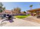 Large backyard patio with seating and a grassy area at 1237 E Heather Ave, Gilbert, AZ 85234