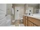 Well-lit bathroom featuring double sinks, tiled floors, and a separate bathtub for relaxation at 1259 E Canyon Trl, San Tan Valley, AZ 85143