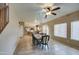 Bright dining area featuring tile flooring, natural light, and a seamless transition to the kitchen at 1259 E Canyon Trl, San Tan Valley, AZ 85143