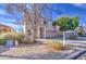 Two-story home with a two-car garage and desert landscaping at 1259 E Canyon Trl, San Tan Valley, AZ 85143