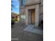 Welcoming home exterior features a light brown front door and low maintenance gravel landscaping at 1259 E Canyon Trl, San Tan Valley, AZ 85143