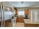 Kitchen with stainless steel appliances, wood cabinets, granite countertops and an island at 1259 E Canyon Trl, San Tan Valley, AZ 85143