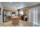 Well-equipped kitchen featuring stainless steel appliances, wood cabinets, and a functional center island at 1259 E Canyon Trl, San Tan Valley, AZ 85143