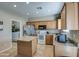 Functional kitchen with stainless steel appliances, a center island, and tile flooring at 1259 E Canyon Trl, San Tan Valley, AZ 85143