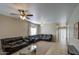 A cozy living room featuring neutral walls, ceiling fan, and plush couches at 1259 E Canyon Trl, San Tan Valley, AZ 85143