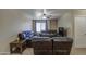 Comfortable carpeted living room with multiple sofas, natural lighting, and a ceiling fan at 1259 E Canyon Trl, San Tan Valley, AZ 85143