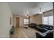 Bright living room features a ceiling fan, tile and carpet flooring and plenty of seating at 1259 E Canyon Trl, San Tan Valley, AZ 85143