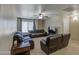 Comfortable living room featuring a ceiling fan, neutral carpeting, and a cozy atmosphere at 1259 E Canyon Trl, San Tan Valley, AZ 85143