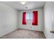 Simple bedroom with red curtains and carpet flooring at 14210 N 135Th Dr, Surprise, AZ 85379