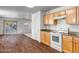 Bright kitchen with wood cabinets and an adjacent dining area at 14210 N 135Th Dr, Surprise, AZ 85379