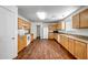 Well-equipped kitchen featuring wood cabinets and granite countertops at 14210 N 135Th Dr, Surprise, AZ 85379