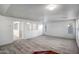 Bright living room with neutral carpeting and hardwood accents at 14210 N 135Th Dr, Surprise, AZ 85379