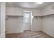 Large walk-in closet with shelving and window at 14210 N 135Th Dr, Surprise, AZ 85379