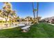 Community with pond, fountain, landscaping, and seating at 14300 W Bell Rd # 207, Surprise, AZ 85374