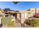 Front view of condo with gate, landscaping, and patio at 14300 W Bell Rd # 207, Surprise, AZ 85374