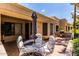 Spacious patio with seating area, umbrella, and grill at 14300 W Bell Rd # 207, Surprise, AZ 85374